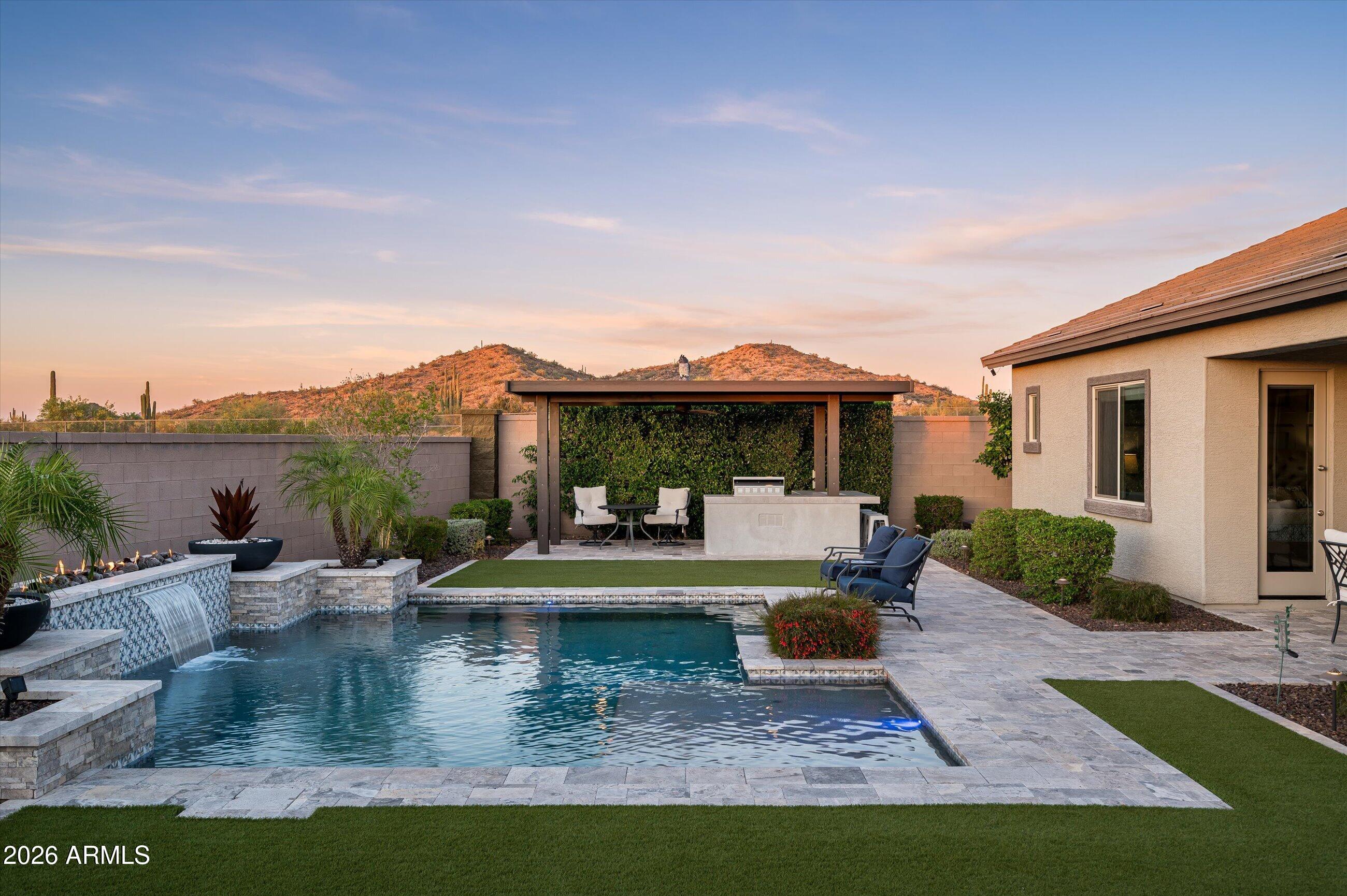 6406 Copper Springs Road Phoenix, AZ 85083 - Photo 35 of 59 a view of a house with backyard water fountain and sitting area