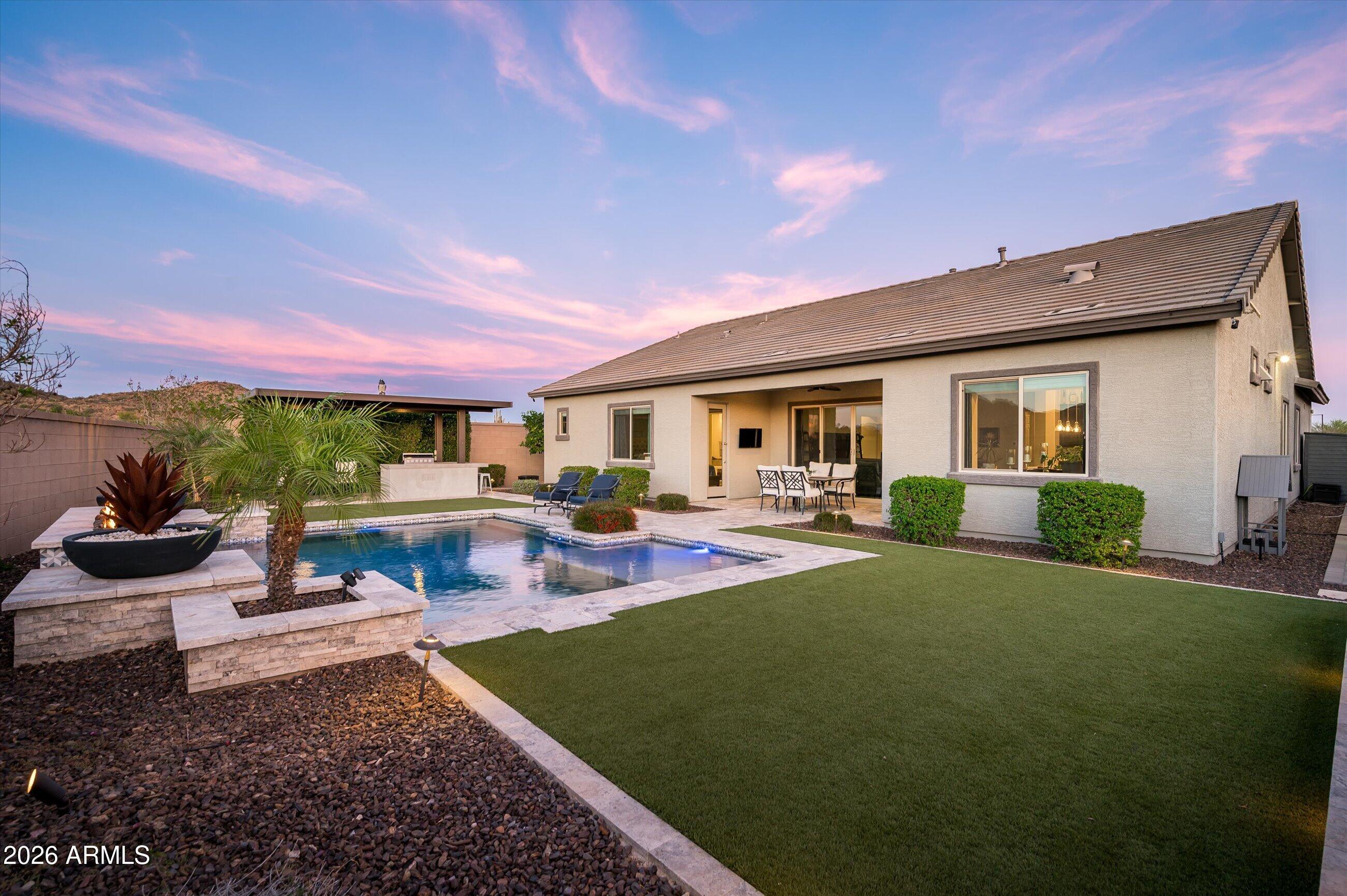 6406 Copper Springs Road Phoenix, AZ 85083 - Photo 38 of 59 a view of a house with swimming pool and sitting area