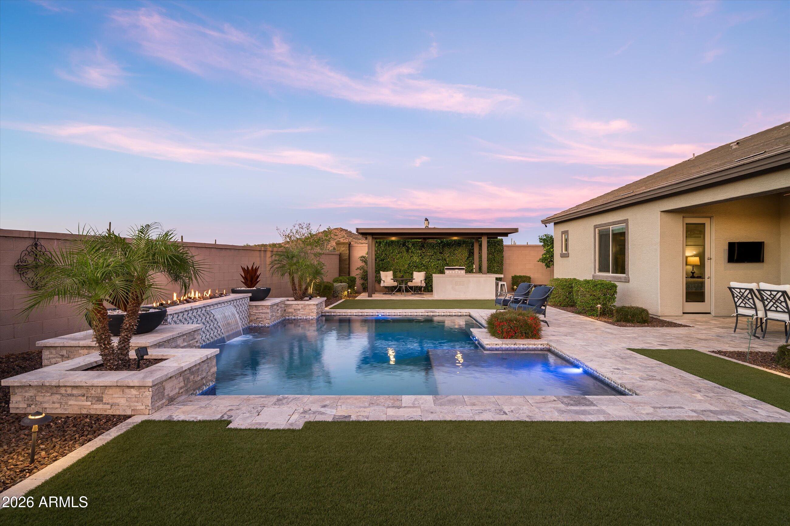 6406 Copper Springs Road Phoenix, AZ 85083 - Photo 39 of 59 a view of a swimming pool with lounge chairs in patio
