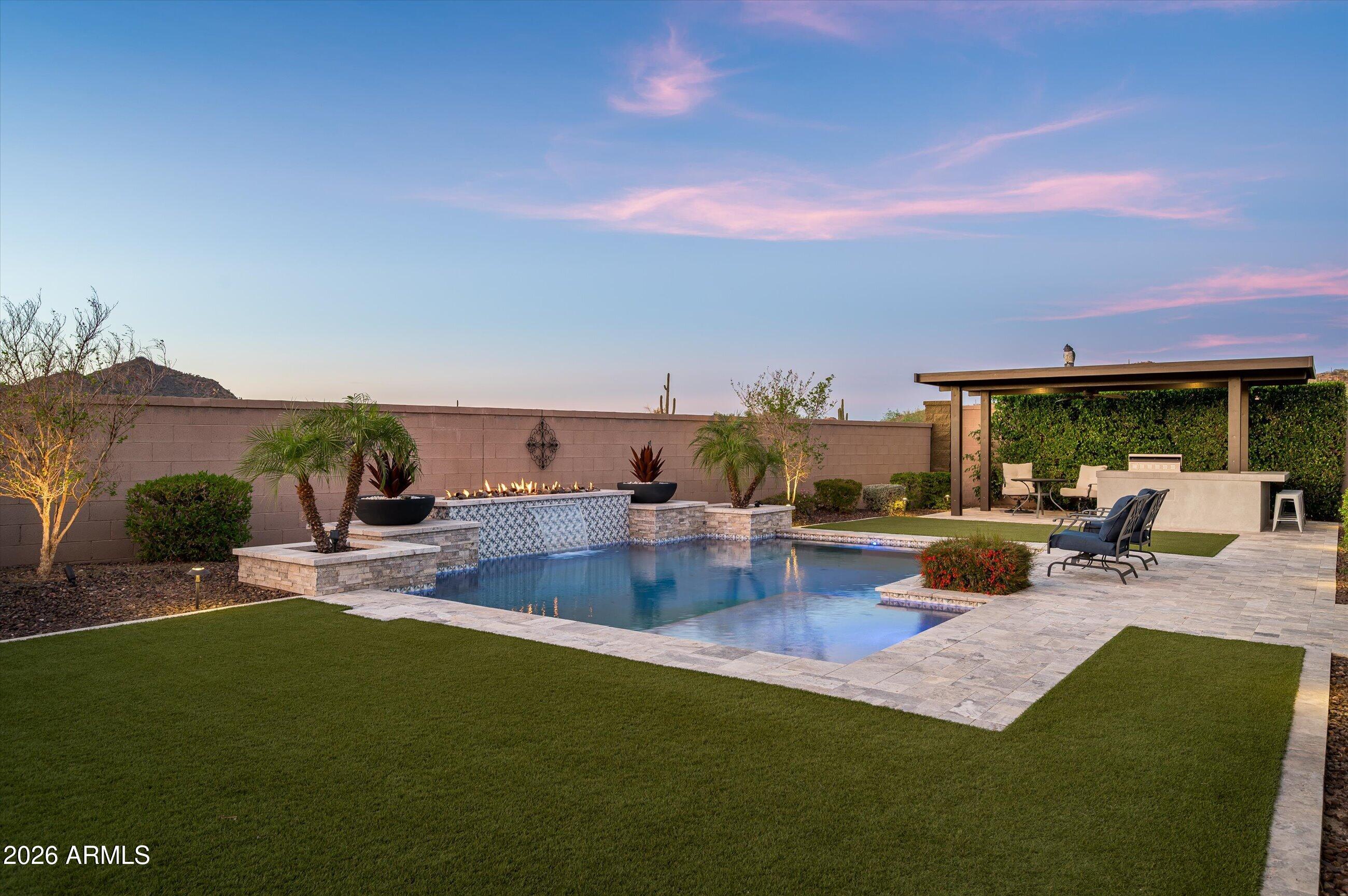 6406 Copper Springs Road Phoenix, AZ 85083 - Photo 3 of 59 a view of swimming pool with outdoor seating and a garden