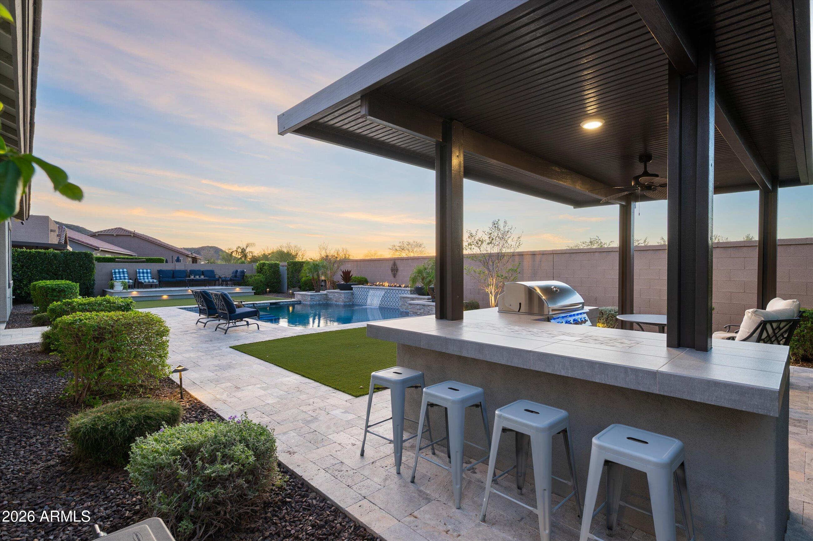 6406 Copper Springs Road Phoenix, AZ 85083 - Photo 44 of 59 a view of a patio with dining table and chairs with wooden floor