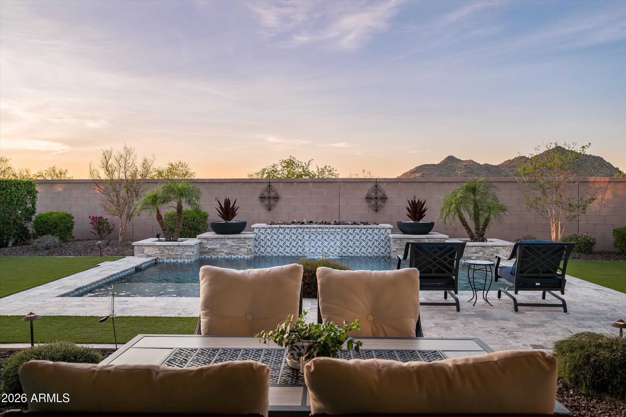 6406 Copper Springs Road Phoenix, AZ 85083 - Photo 46 of 59 an outdoor sitting area with furniture and a garden