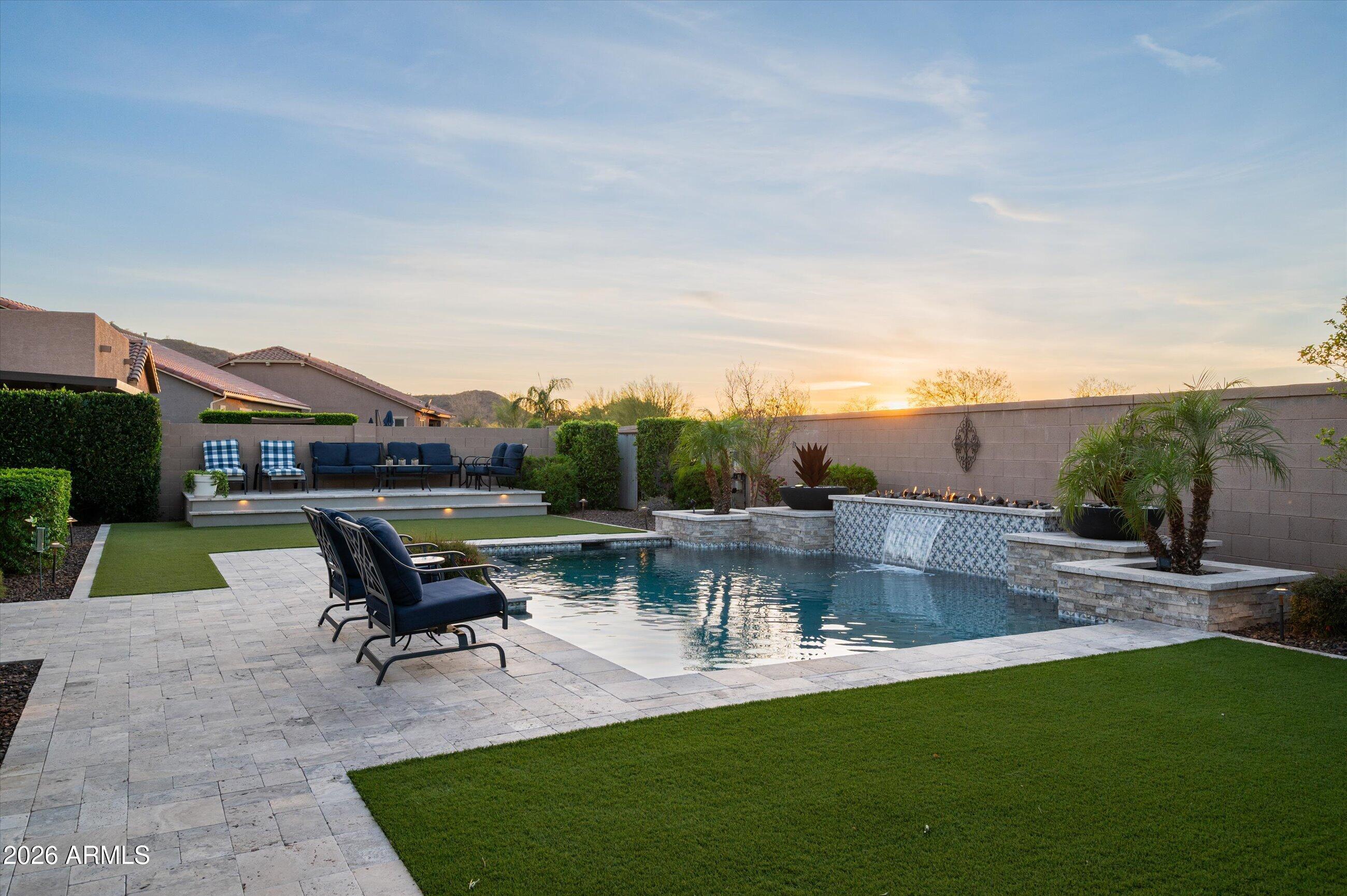6406 Copper Springs Road Phoenix, AZ 85083 - Photo 47 of 59 a view of a swimming pool with lawn chairs and a fire pit