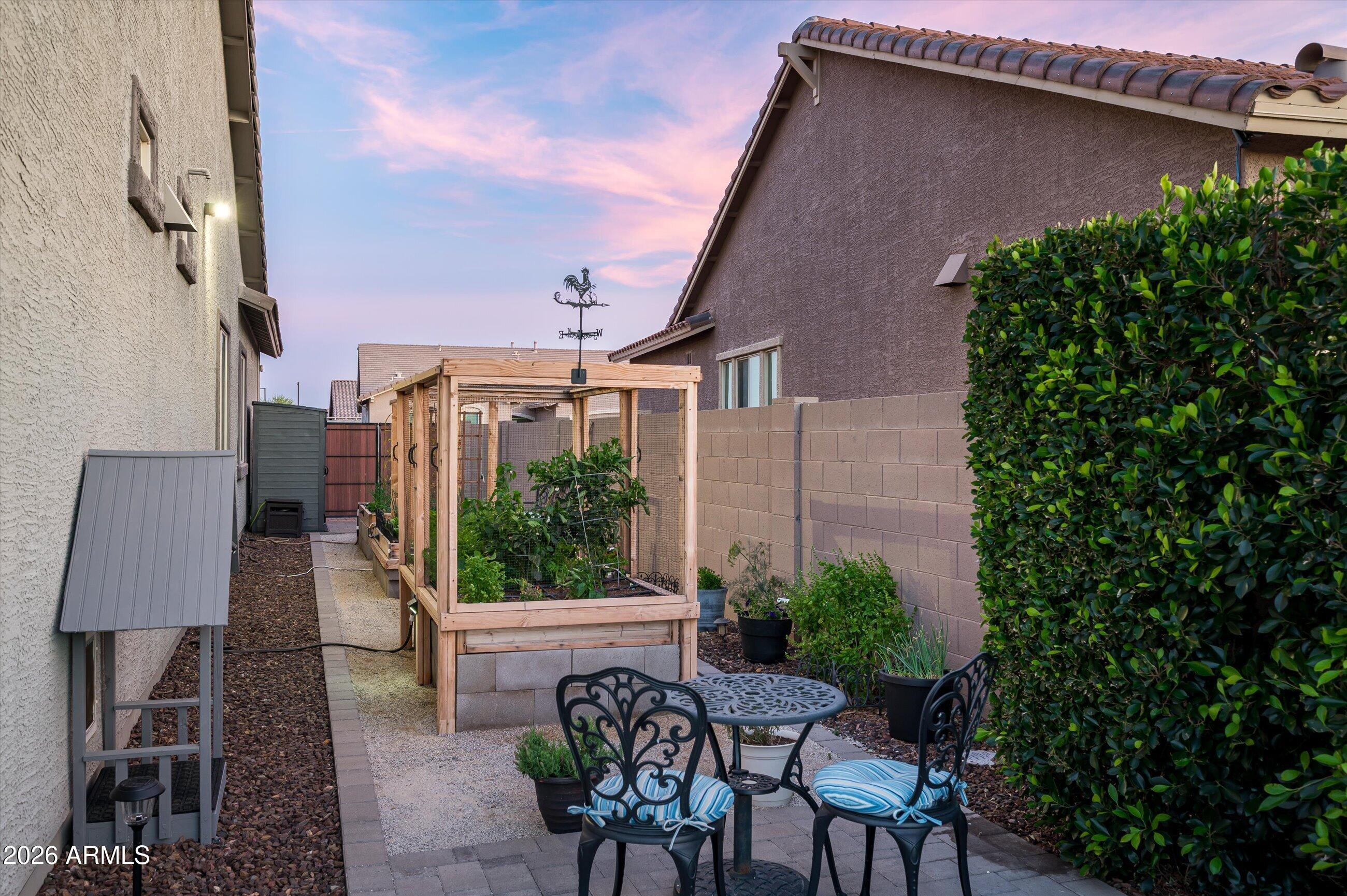 6406 Copper Springs Road Phoenix, AZ 85083 - Photo 50 of 59 a backyard of a house with table and chairs