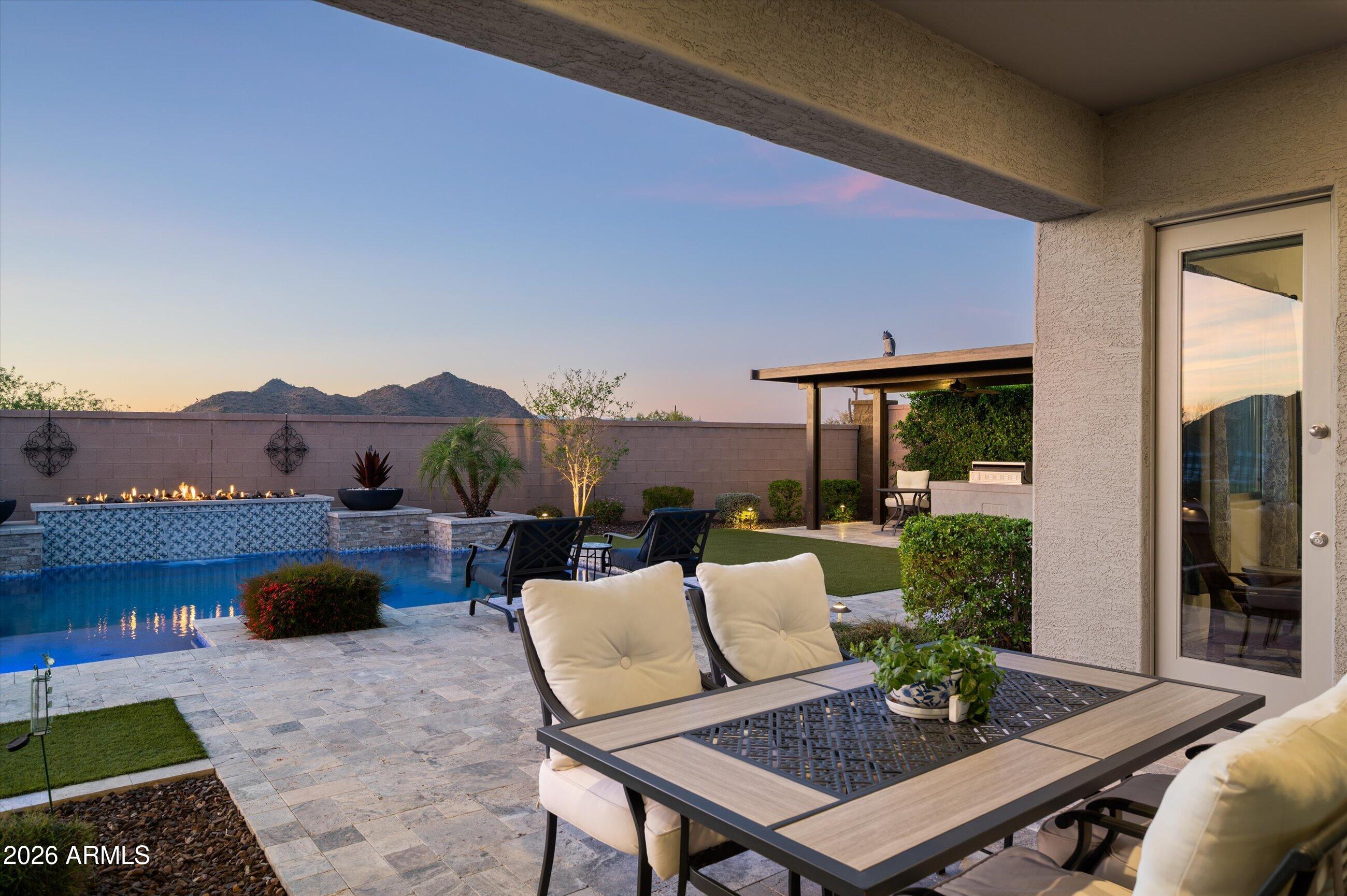 6406 Copper Springs Road Phoenix, AZ 85083 - Photo 5 of 59 a view of a patio with couches potted plants and a table