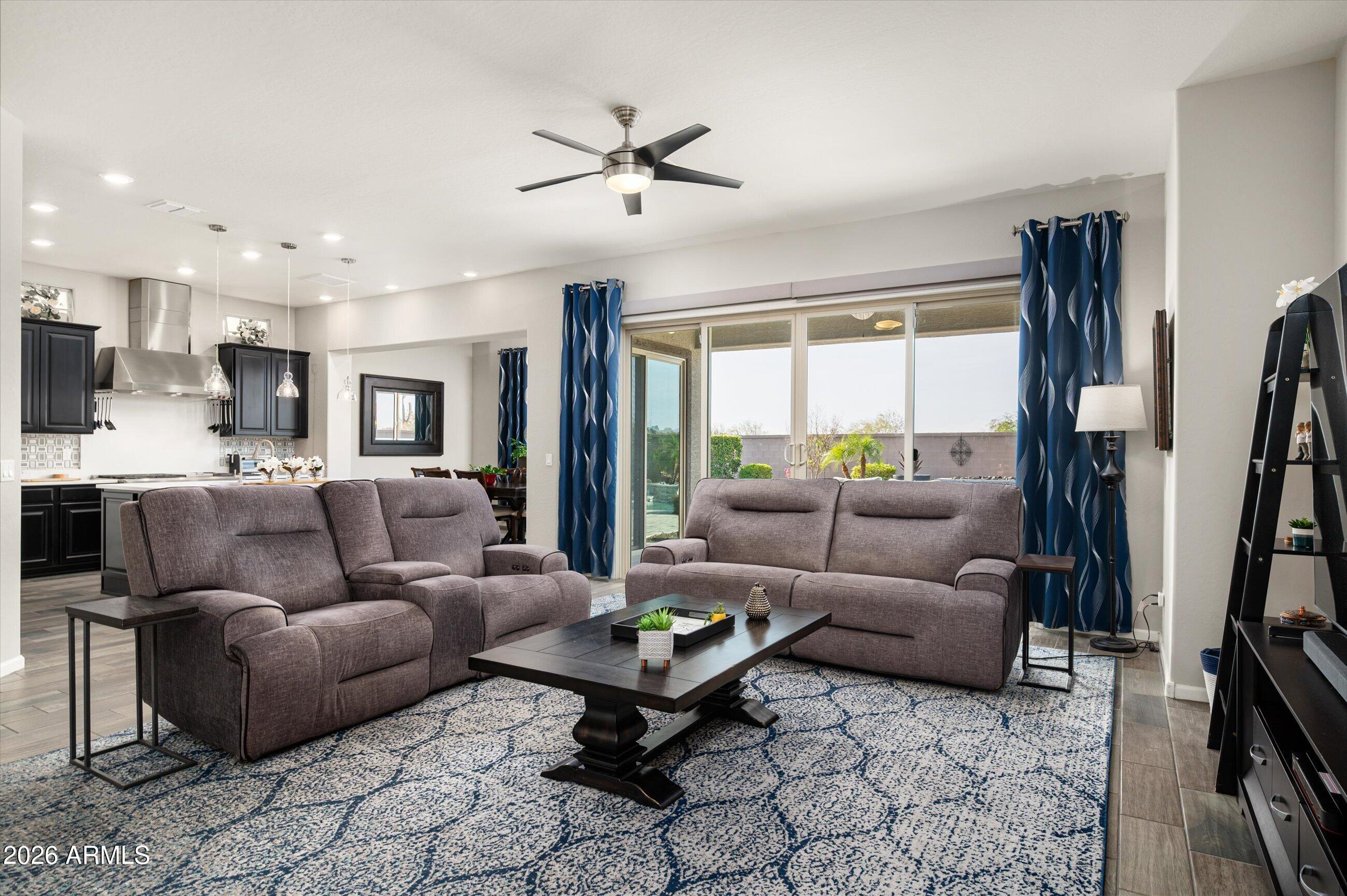 6406 Copper Springs Road Phoenix, AZ 85083 - Photo 8 of 59 a living room with furniture and a large window