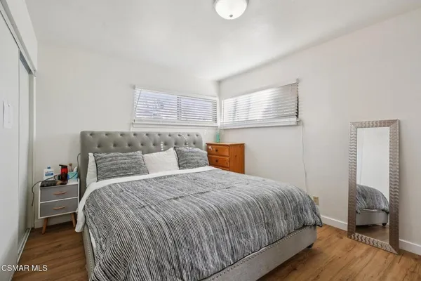 a bedroom with a bed and a walk in closet