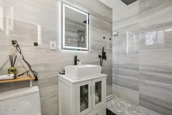 a bathroom with a sink and mirror