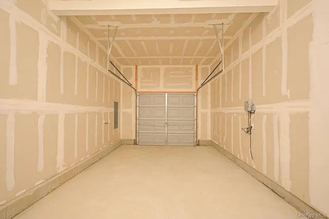 a view of an empty room with a white door