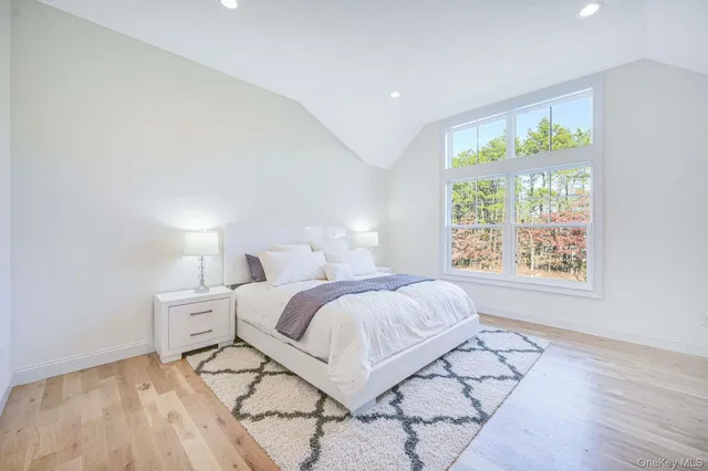 a bed room with a bed and a window