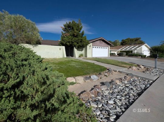 736 Sherri Street Ridgecrest, CA 93555 - Photo 40 of 42 a front view of a house with a yard