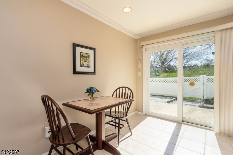 504 Reading Circle Bridgewater, NJ 08807 - Photo 16 of 35 a view of a dining room with furniture and wooden floor
