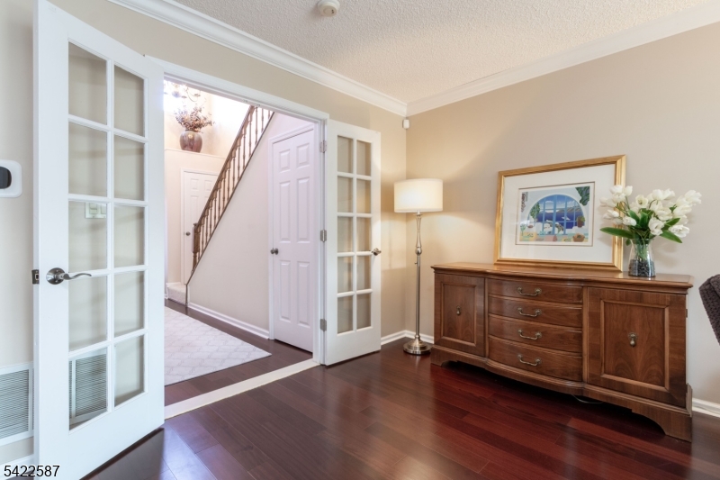 504 Reading Circle Bridgewater, NJ 08807 - Photo 17 of 35 a view of front door with hallway and wooden floor