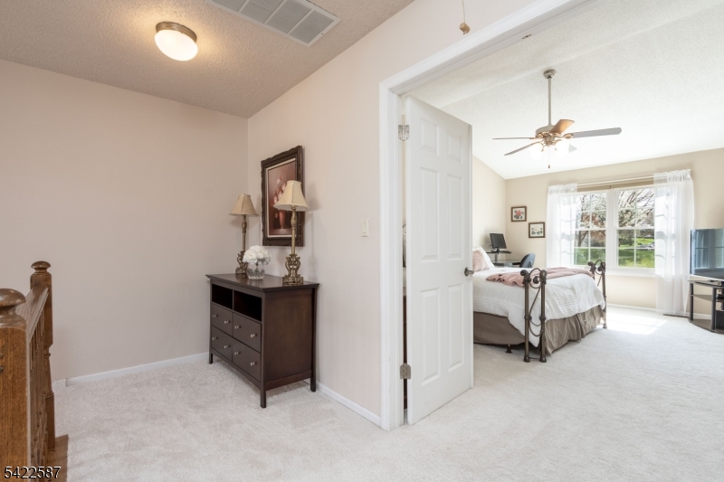 504 Reading Circle Bridgewater, NJ 08807 - Photo 19 of 35 a living room with furniture and a chandelier