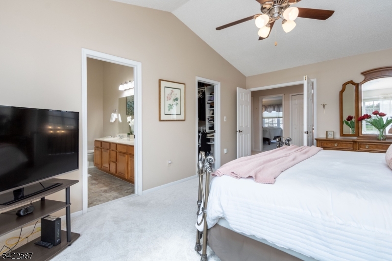 504 Reading Circle Bridgewater, NJ 08807 - Photo 21 of 35 a bedroom with a bed and a flat screen tv