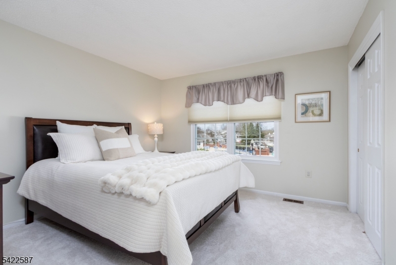 504 Reading Circle Bridgewater, NJ 08807 - Photo 25 of 35 a bedroom with a bed and a window