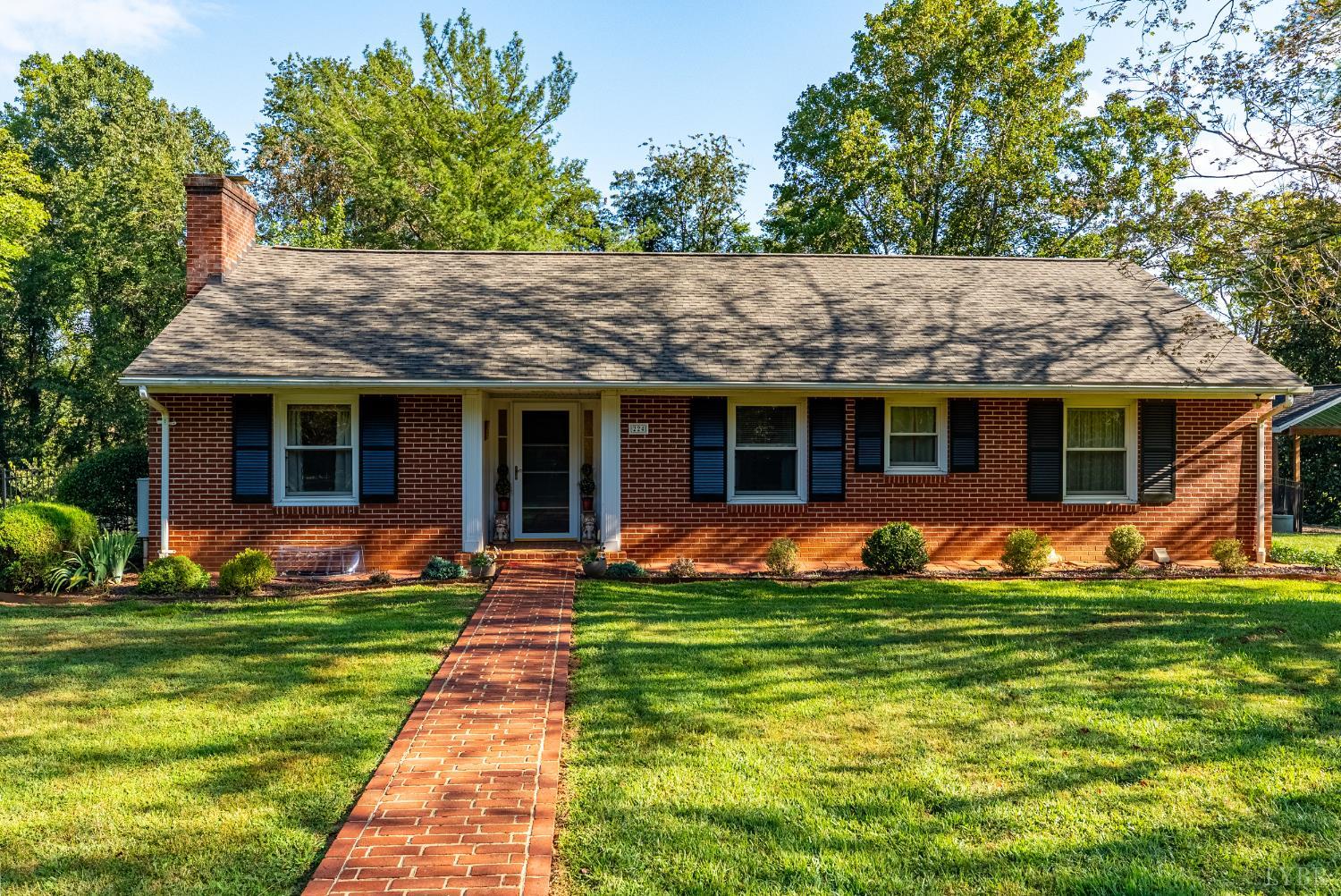a front view of a house with a yard and porch