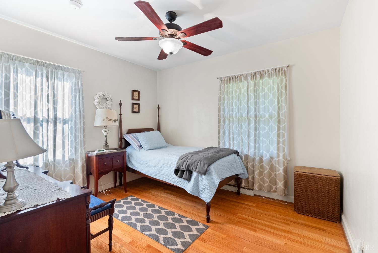 224 Sunset Drive Amherst, VA 24521 - Photo 16 of 34 a bedroom with a bed and wooden floor