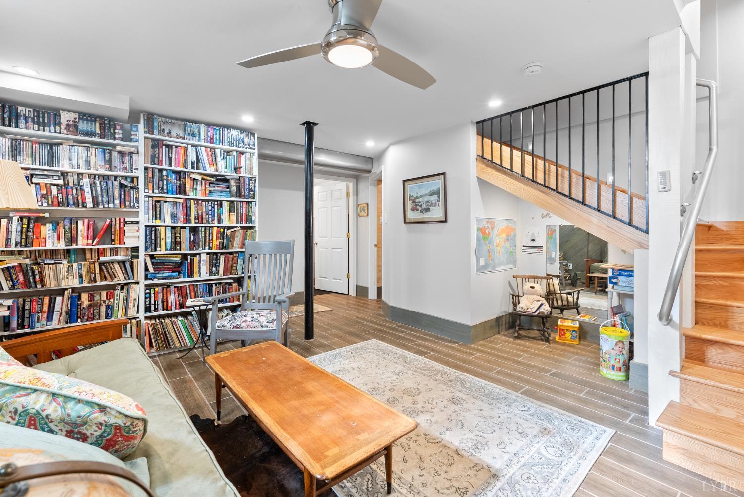 224 Sunset Drive Amherst, VA 24521 - Photo 20 of 34 a living room with furniture and a book shelf