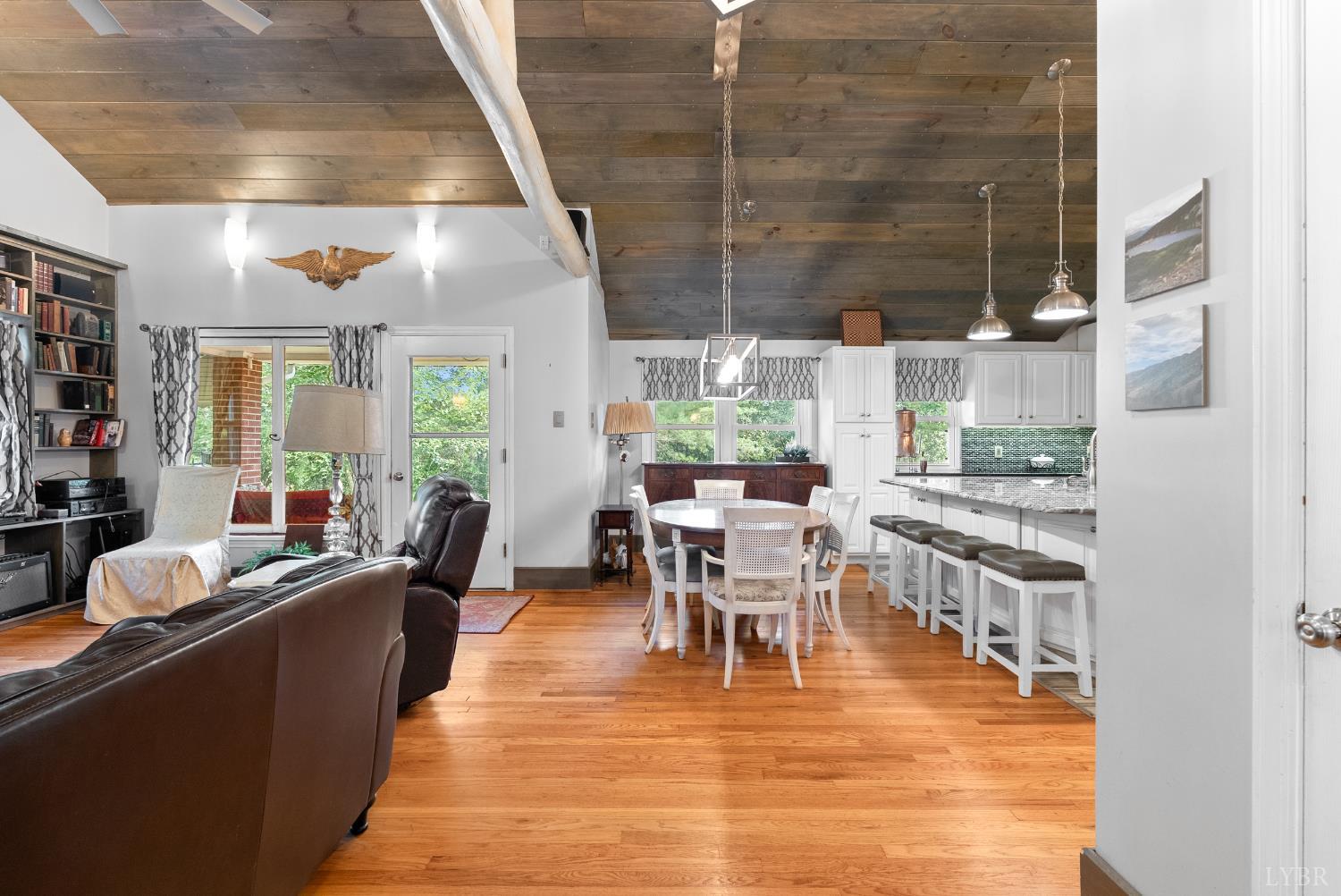 224 Sunset Drive Amherst, VA 24521 - Photo 3 of 34 a dining room with stainless steel appliances kitchen island granite countertop a table chairs and a view of living room