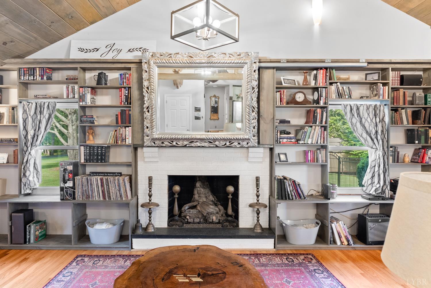 224 Sunset Drive Amherst, VA 24521 - Photo 7 of 34 a living room with furniture a fireplace and a large window