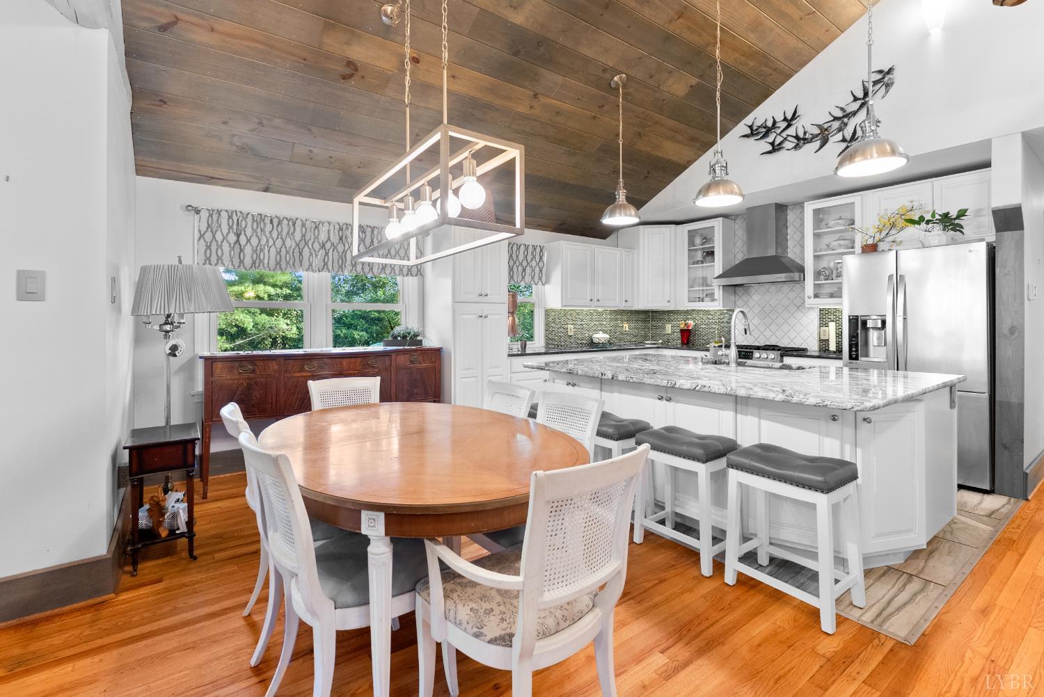 224 Sunset Drive Amherst, VA 24521 - Photo 9 of 34 a kitchen with stainless steel appliances granite countertop a white cabinets and a stove