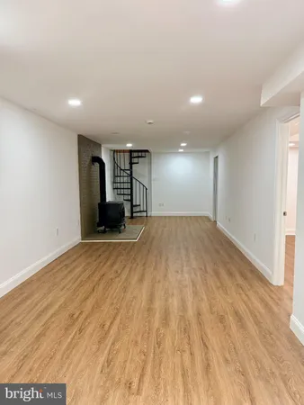 a view of balcony with wooden floor and fence