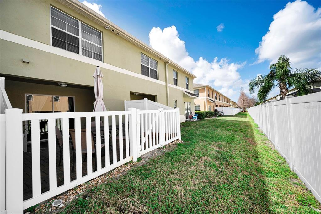 9736 Trumpet Vine Loop Trinity, FL 34655 - Photo 26 of 35 a view of a house with backyard and porch
