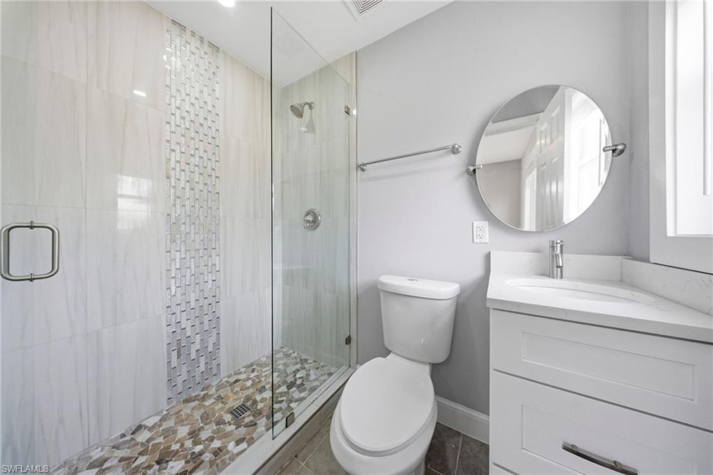 4375 Golden Gate Parkway Naples, FL 34116 - Photo 14 of 34 Full bath featuring vanity and a stall shower