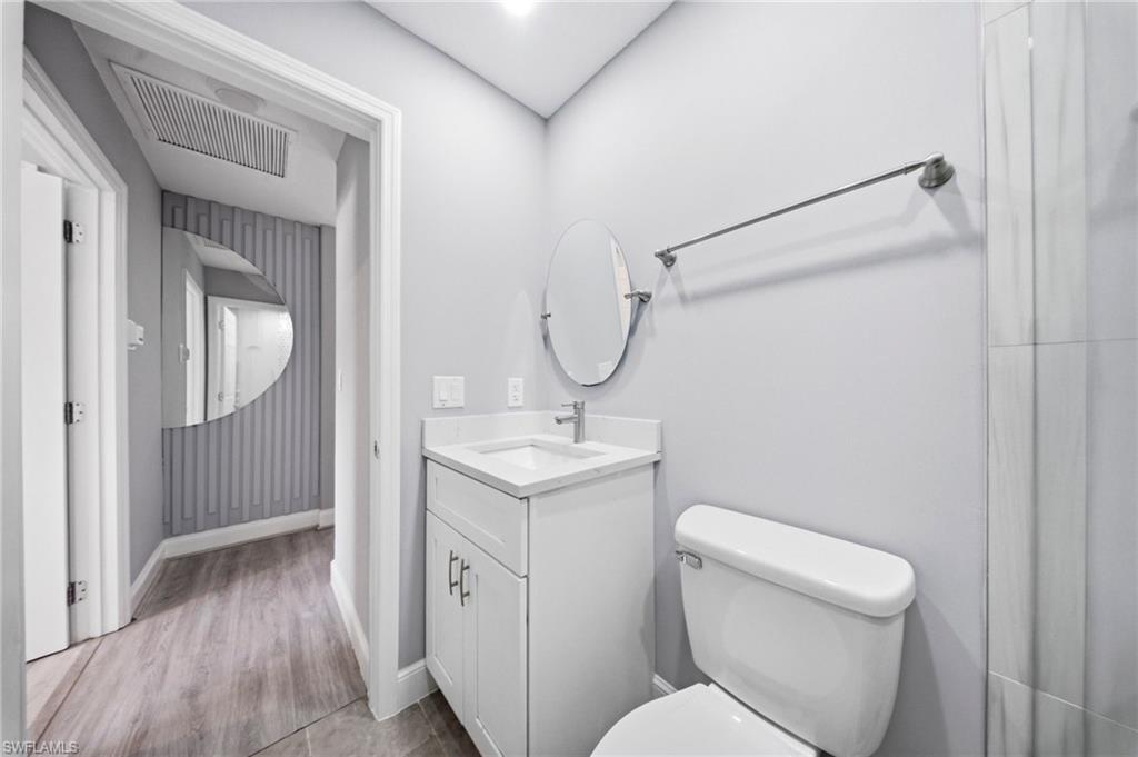 4375 Golden Gate Parkway Naples, FL 34116 - Photo 17 of 34 Bathroom with vanity and toilet