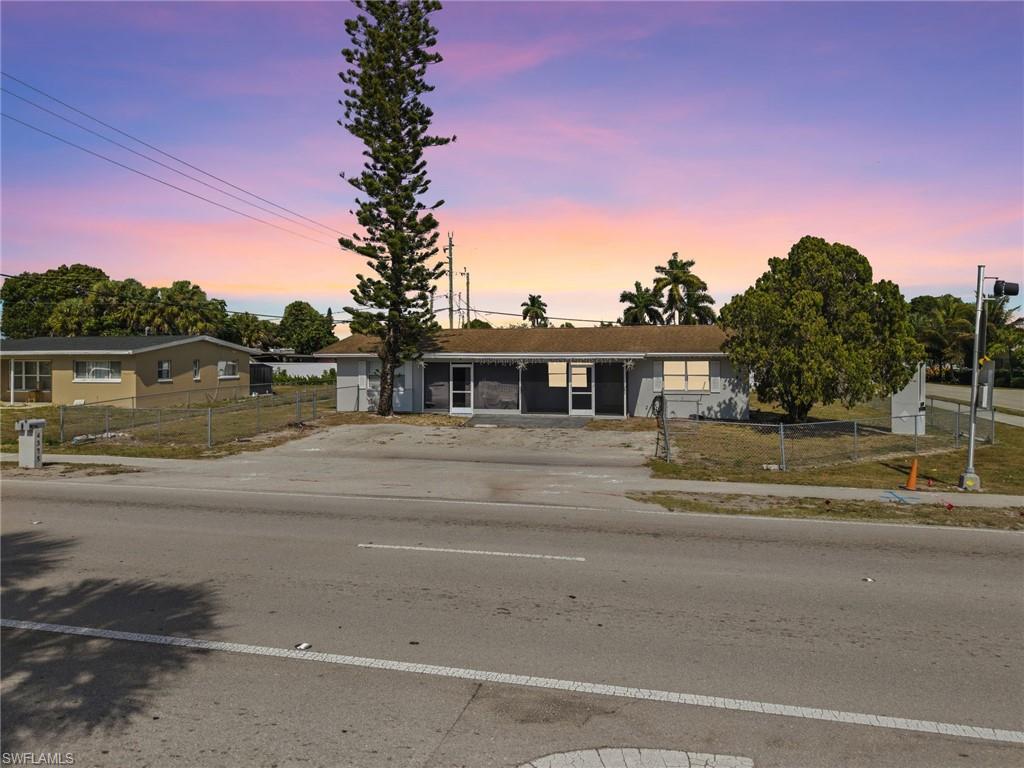 4375 Golden Gate Parkway Naples, FL 34116 - Photo 2 of 34 Single story home featuring a fenced front yard and driveway
