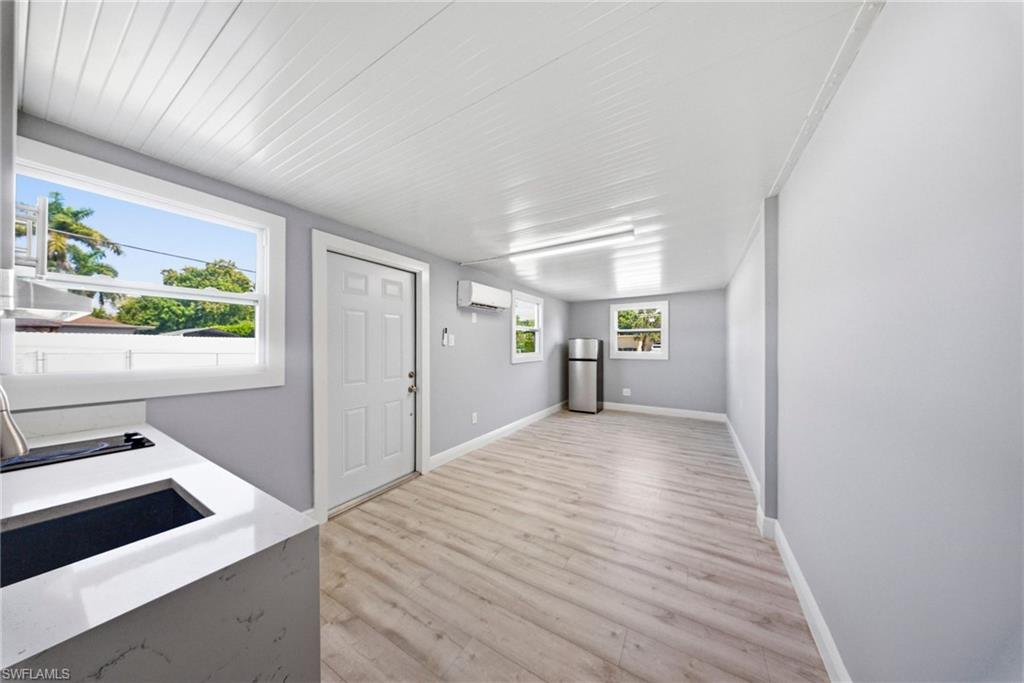 4375 Golden Gate Parkway Naples, FL 34116 - Photo 21 of 34 Entrance foyer featuring light wood-style floors and a mini split for heating / cooling