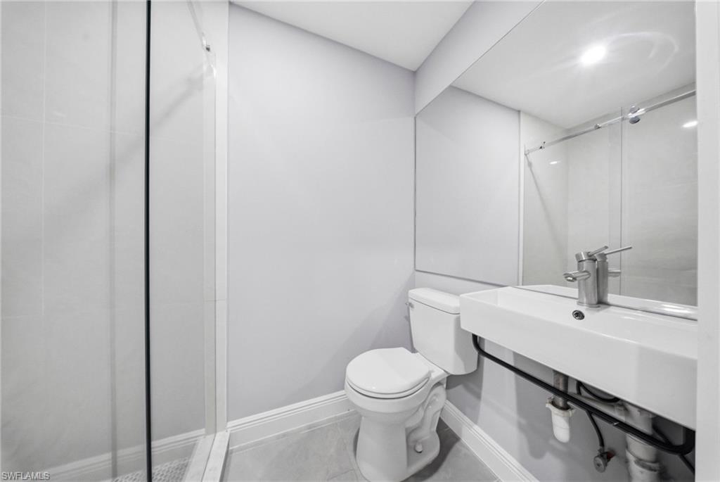 4375 Golden Gate Parkway Naples, FL 34116 - Photo 25 of 34 Bathroom featuring toilet and an enclosed shower