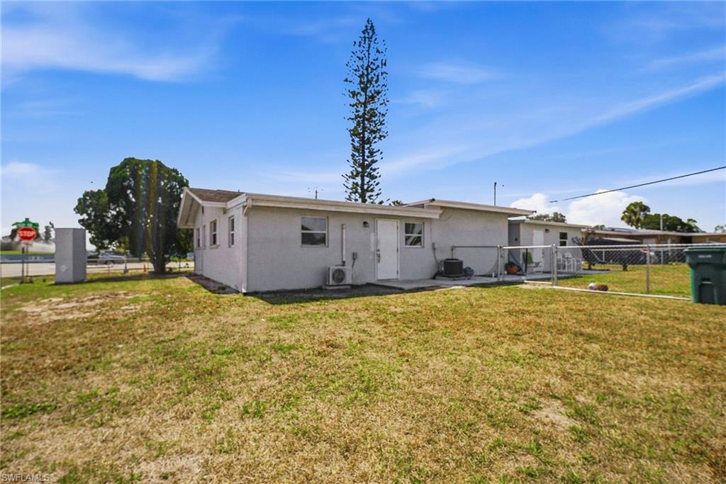 4375 Golden Gate Parkway Naples, FL 34116 - Photo 26 of 34 Back of house featuring a fenced backyard, stucco siding, and a patio area