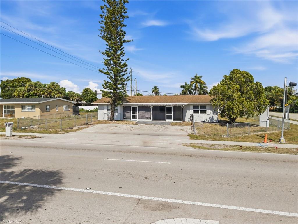 4375 Golden Gate Parkway Naples, FL 34116 - Photo 30 of 34 Ranch-style house featuring a fenced front yard and concrete driveway