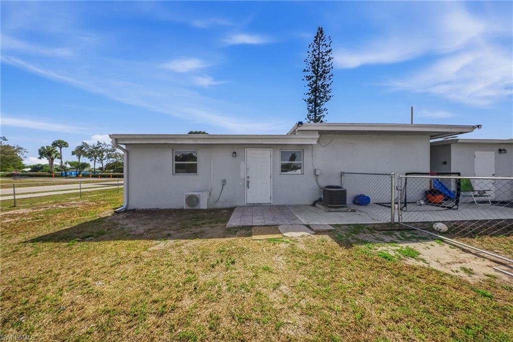 4375 Golden Gate Parkway Naples, FL 34116 - Photo 34 of 34 Back of property with a patio, stucco siding, and a gate