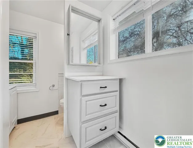 a view of a dresser with window