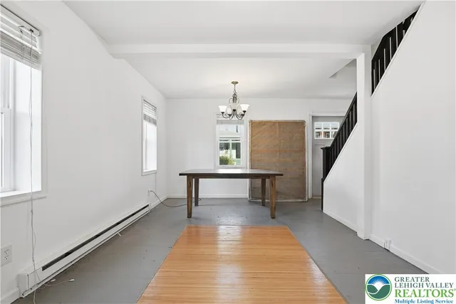 a view of dining room and wooden floor