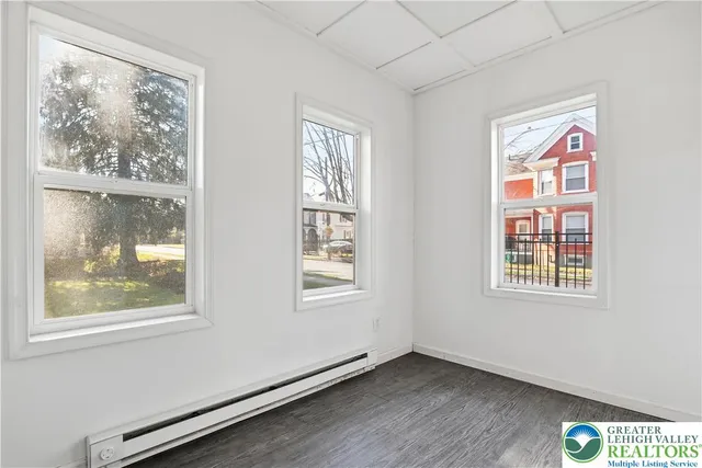 a view of an empty room with a window