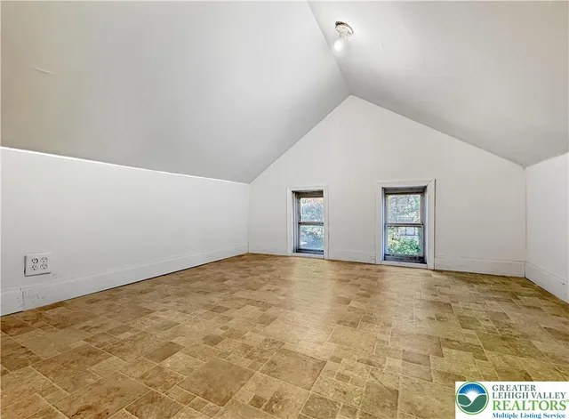 a view of an empty room and window