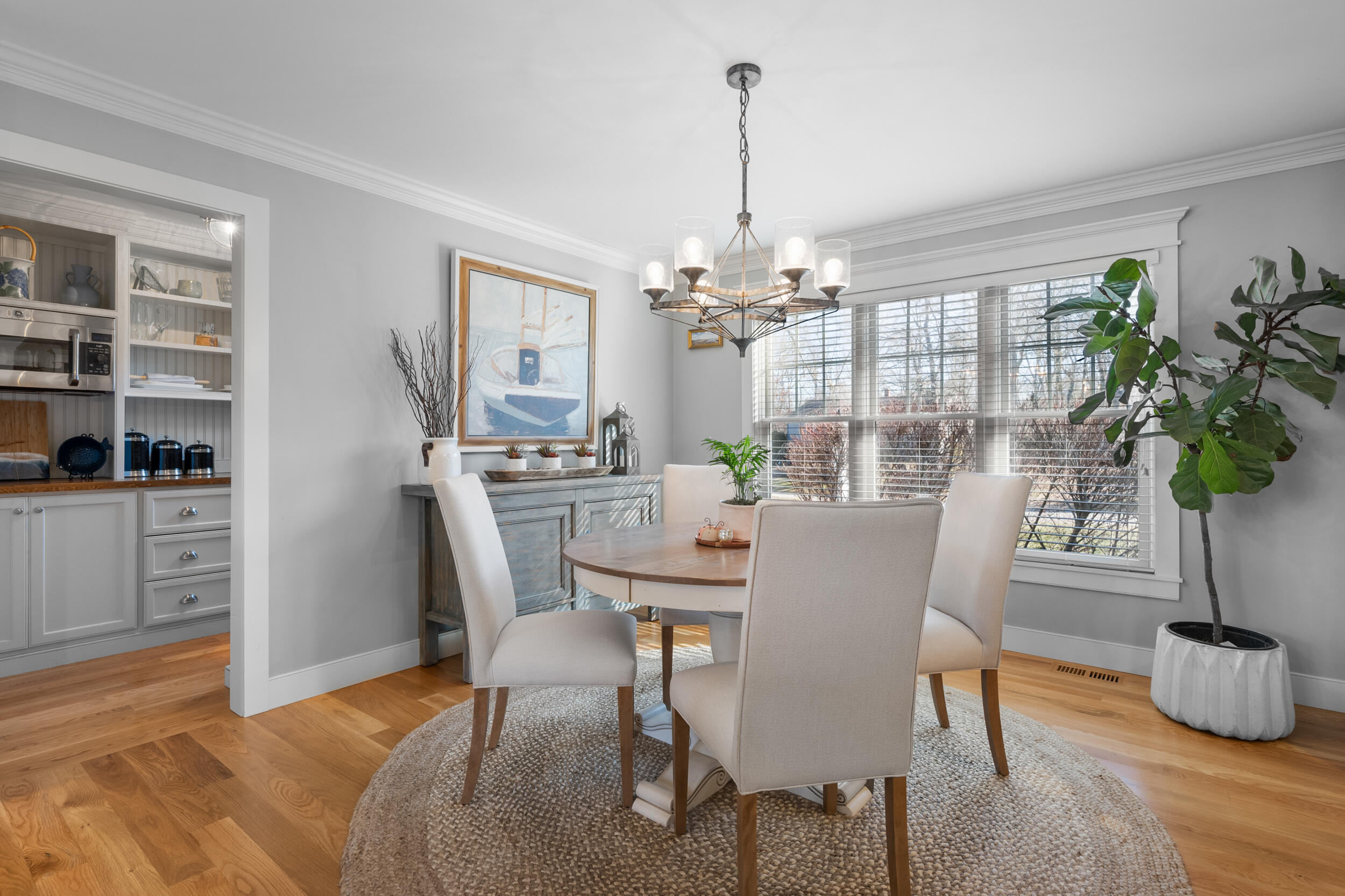 6 Bunker Circle Sandwich, MA 02563 - Photo 12 of 43 a dining room with furniture potted plants and wooden floor