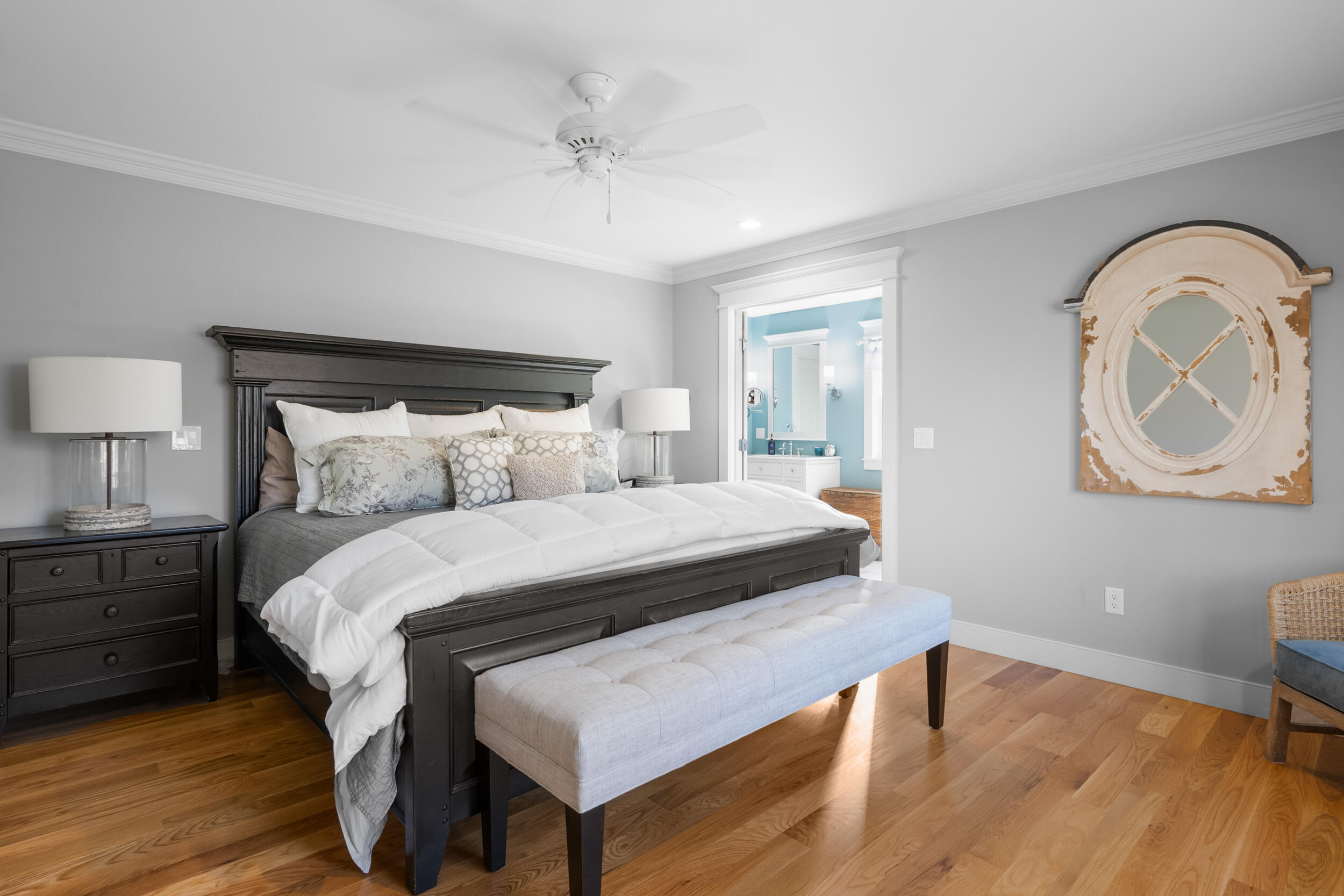 6 Bunker Circle Sandwich, MA 02563 - Photo 17 of 43 a bedroom with a bed a mirror and a lamp on dresser