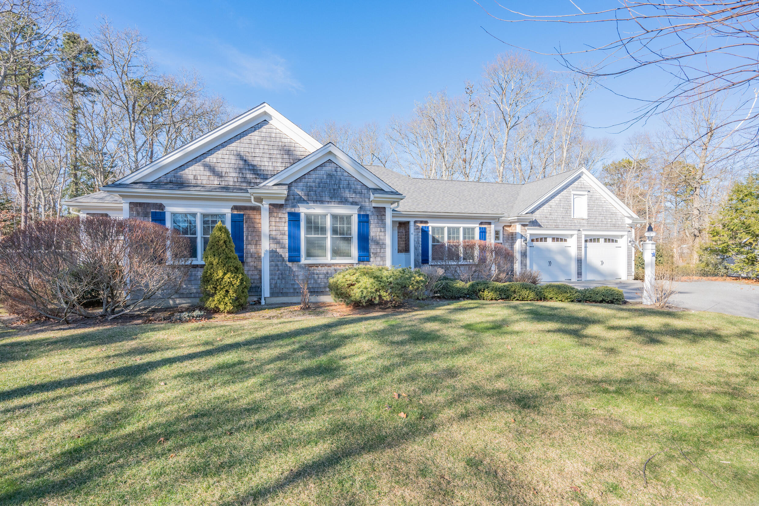 6 Bunker Circle Sandwich, MA 02563 - Photo 2 of 43 a view of a big house with a big yard and large tree