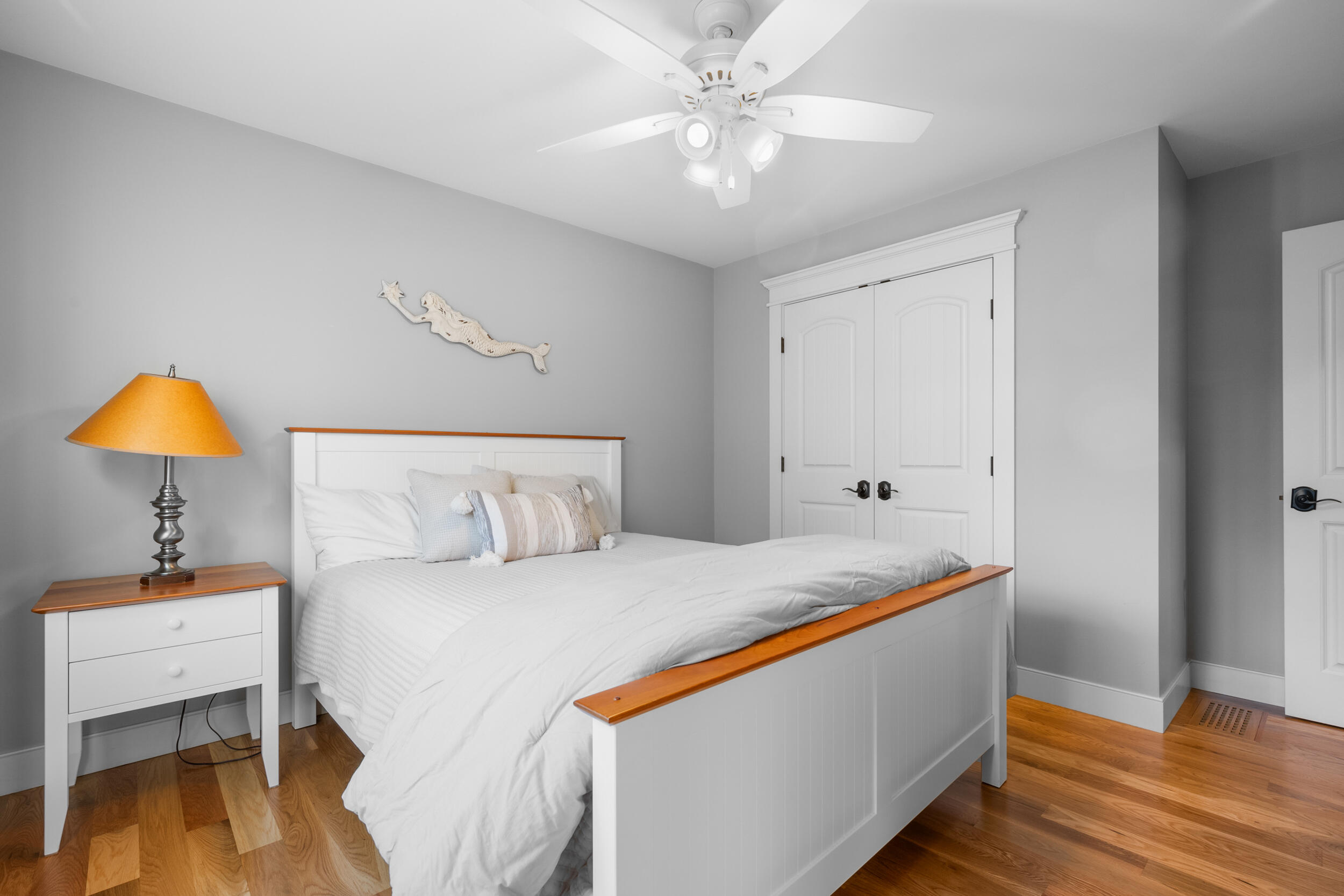 6 Bunker Circle Sandwich, MA 02563 - Photo 22 of 43 a bedroom with a bed and a chandelier