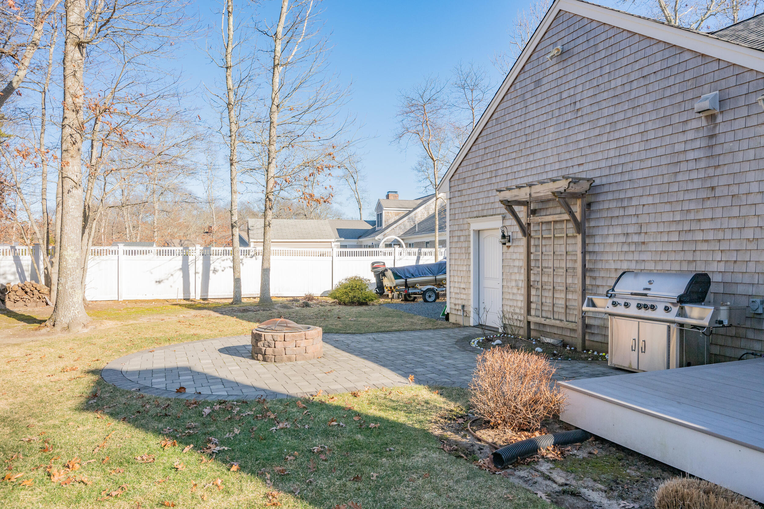 6 Bunker Circle Sandwich, MA 02563 - Photo 35 of 43 a backyard of a house with a yard fire pit and outdoor seating