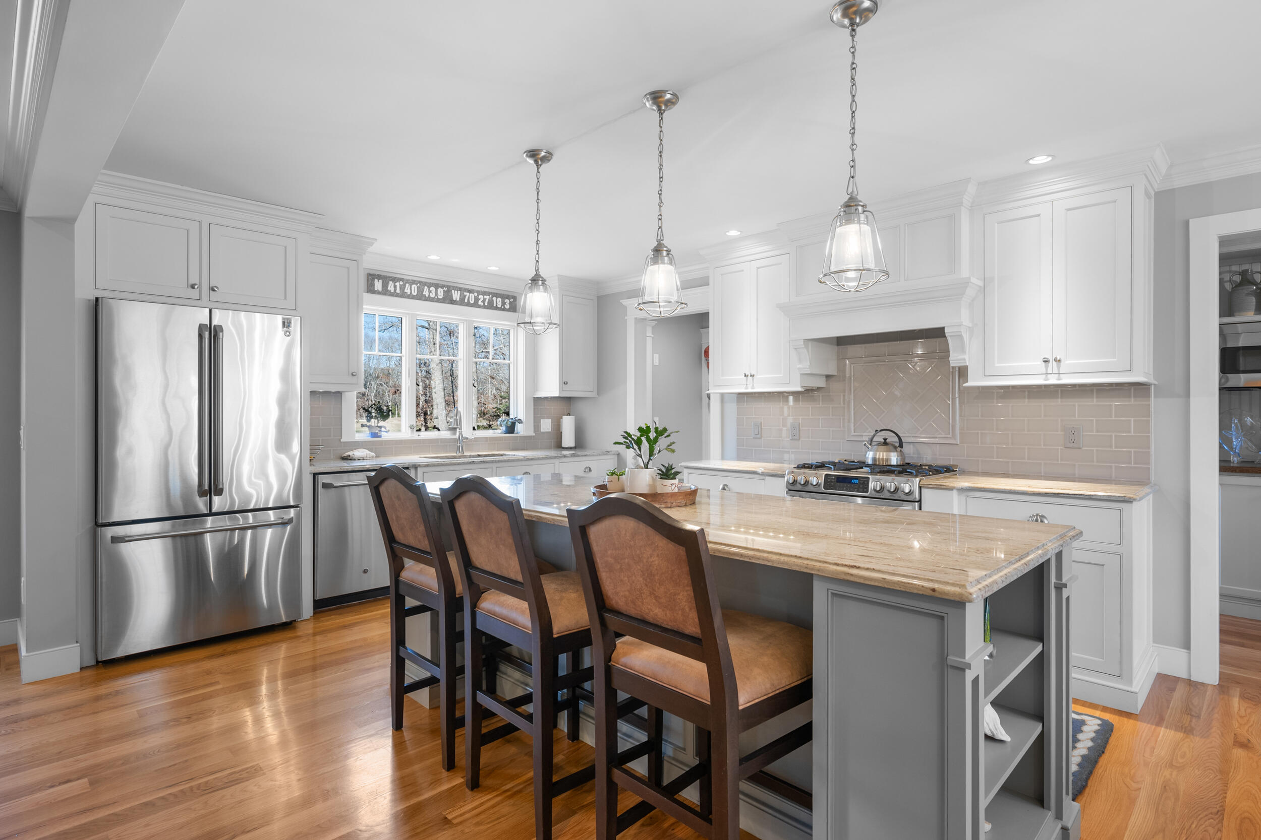 6 Bunker Circle Sandwich, MA 02563 - Photo 7 of 43 a kitchen with stainless steel appliances granite countertop a sink a stove a refrigerator and island with wooden floor