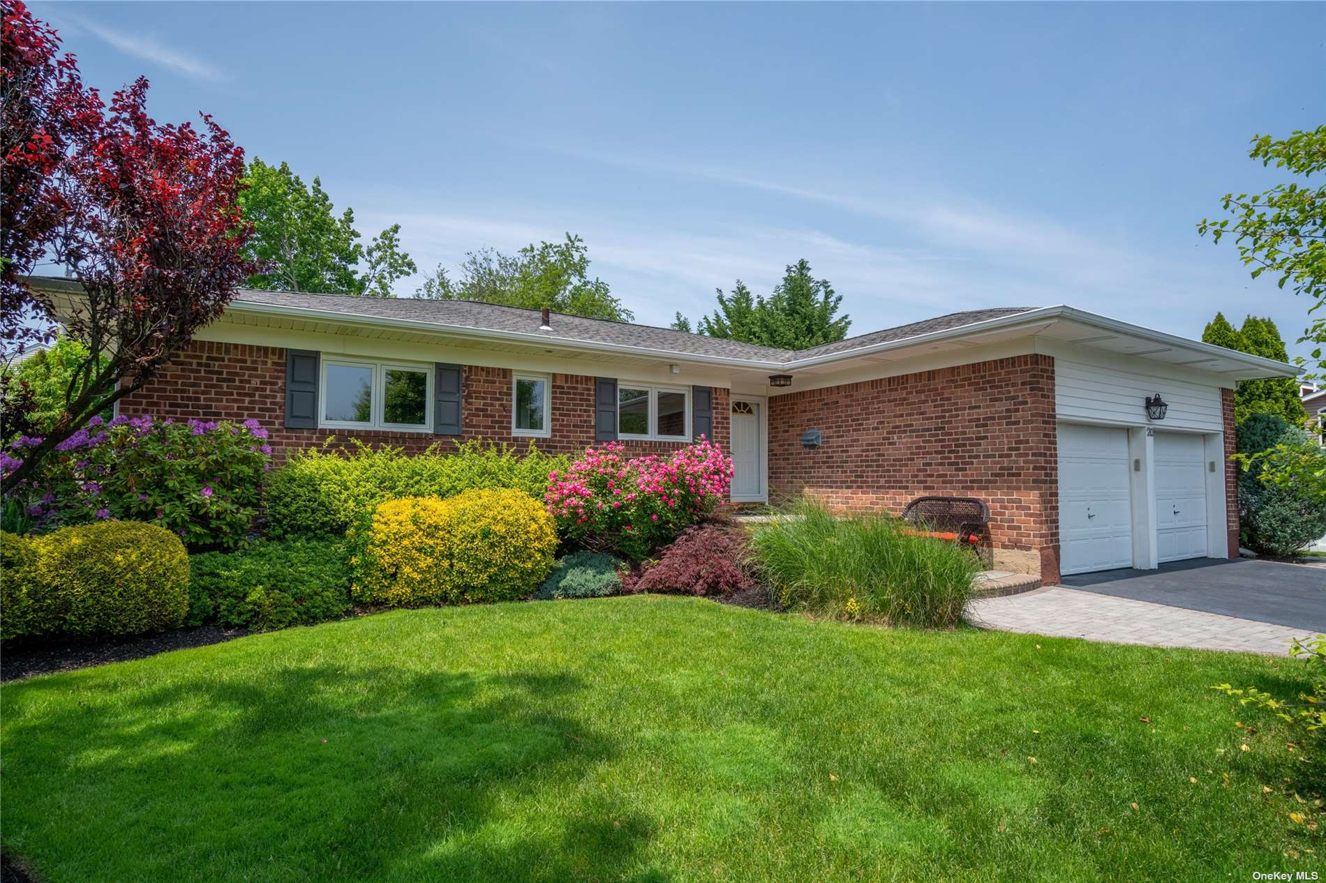20 Orange Drive Jericho, NY 11753 - Photo 1 of 1 a front view of a house with a garden