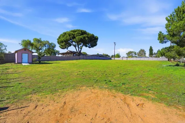 aerial view of multiple houses with yard