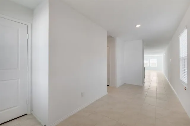 a view of hallway with windows