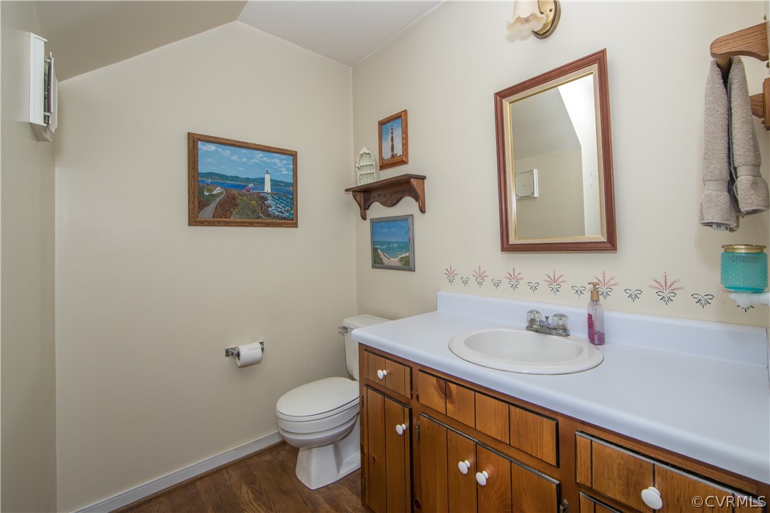 807 Dawnwood Road Midlothian, VA 23114 - Photo 14 of 37 a bathroom with a toilet sink and mirror